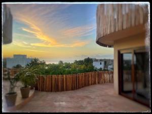 a view from the balcony of a house with a fence at Casa Noma-Noma Holbox in Holbox Island