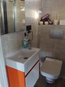 a bathroom with a sink and a toilet at Carpe Diem (Tina) in Şarköy