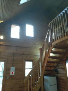 a wooden staircase in a cabin with two windows at Hot Spring Resort Usui Pass Forest Park "Natural H - Vacation STAY 60418v in Karuizawa