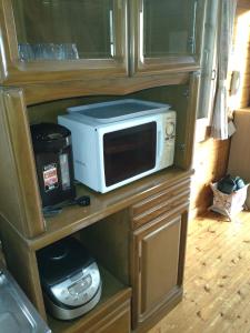 a microwave sitting on a counter in a kitchen at Hot Spring Resort Usui Pass Forest Park "Natural H - Vacation STAY 60418v in Karuizawa