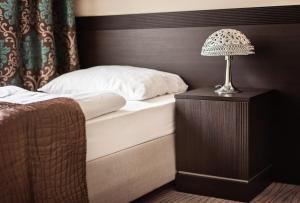 Postel nebo postele na pokoji v ubytování Hotel Willa Adriana