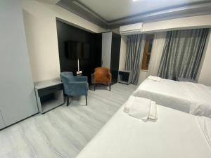 Кровать или кровати в номере Retrol Hotel