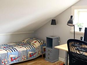מיטה או מיטות בחדר ב-Holiday home Halmstad XII