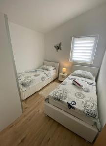 Posteľ alebo postele v izbe v ubytovaní Apartment Megy