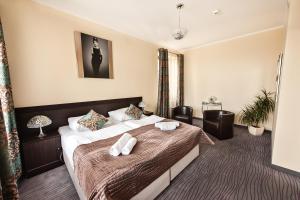 Postel nebo postele na pokoji v ubytování Hotel Willa Adriana