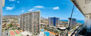 an aerial view of a city with buildings and the ocean at KAI Apartment Playa Paraiso in Playa Paraiso