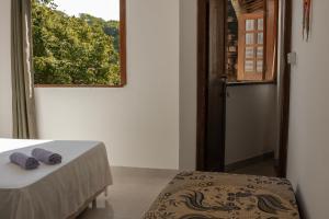 Voodi või voodid majutusasutuse CACAU HOSTEL & SUITES toas
