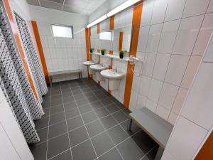 a bathroom with two sinks and two toilets at Barbora kemp Kutná Hora in Kutná Hora +23 photos