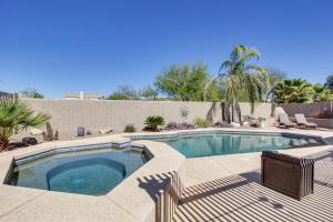 a swimming pool in a backyard with a deck at Stunning Oro Valley Home Near Catalina State Park in Oro Valley