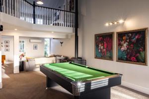 a living room with a pool table in it at Havelock Homestead in Havelock North