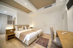 A bed or beds in a room at Hotel Ristorante Da Tullio