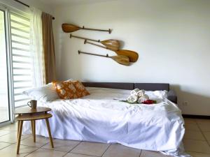 Una cama o camas en una habitación de Spirit of pacific Central calme et spacieux F2 pour 4 personnes