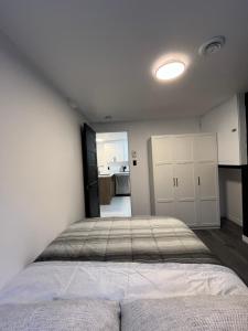 a bedroom with a large bed in a room at Luxurya in Drummondville