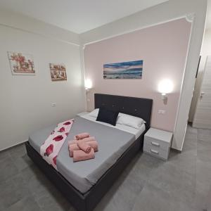Postel nebo postele na pokoji v ubytování ACRONE GUEST HOUSE Centro Città (Locazione Turistica)