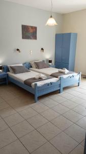 a bedroom with two beds in a room at Romeos Studios in Agia Marina Nea Kydonias