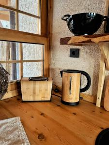 a coffee pot sitting on a wooden floor next to a window at Loft Country Kaş in Kas +35 photos