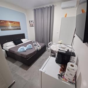 Postel nebo postele na pokoji v ubytování ACRONE GUEST HOUSE Centro Città (Locazione Turistica)