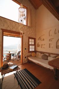 a bedroom with a bed and a large window at Loft Country Kaş in Kaş +37 photos