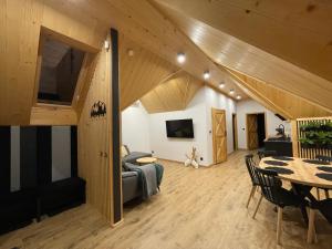 a living room with a couch and a table at Apartament 920m n.p.m. in Zakopane