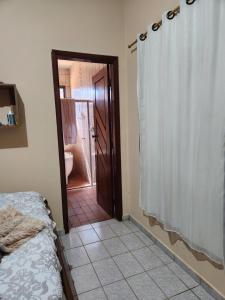 Katil atau katil-katil dalam bilik di Hotel Pousada Casa da Terezinha