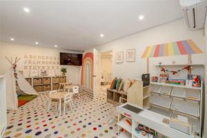 a childrens room with a toy room with a playroom with a table at Sugar Bay Barbados - All Inclusive in Bridgetown