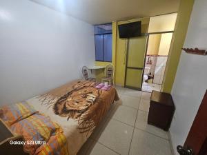 a bedroom with a bed with a tiger design on it at Su Majestad II in Huanta