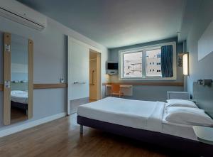 Кровать или кровати в номере ibis budget RJ Praia de Botafogo