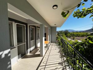 a balcony of a house with a view at Kırevi-Airport in Ortaca