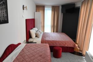Voodi või voodid majutusasutuse Apartments Imper - IMD toas