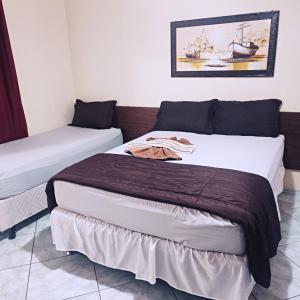 Ένα ή περισσότερα κρεβάτια σε δωμάτιο στο Hotel Ita Avenida