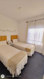 Krevet ili kreveti u jedinici u objektu Calma House Parque y sol Depto con amenities