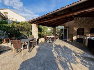 Patio nebo venkovní prostory v ubytování Apartment and Rooms Zora