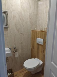 a small bathroom with a toilet and a sink at Reus, cosy apartment in the city's centre in Reus