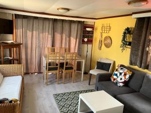 a living room with a couch and a table at Beach house in Zandvoort
