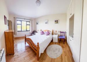 Postel nebo postele na pokoji v ubytování DOONEEN HOUSE