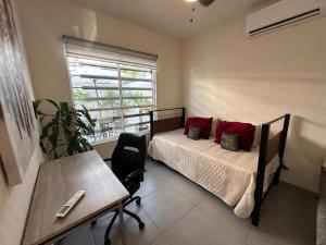 a bedroom with a bed and a table and a window at Casa ISLA RODAS Altavela II in Los Algodones +38 photos