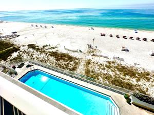 an overhead view of a beach with a swimming pool at Windemere Unit 605 in Pensacola