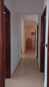 an empty hallway with two doors and a room at Appartement valfleuri1 in Tangier