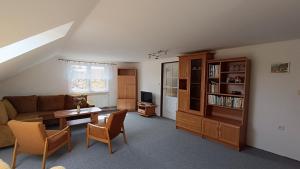 a living room with a couch and a table at Apartment Vcelakov in Včelákov