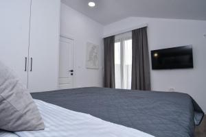 Postel nebo postele na pokoji v ubytování Apartments Šišević