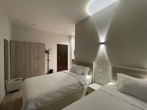 Postel nebo postele na pokoji v ubytování Sleep Inn Apart-Hotel