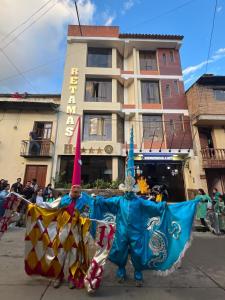 a man dressed up in a costume in a parade at Retamas Hotel EIRL in Cajamarca