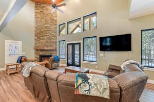 a living room with a couch and a tv at Star Valley Ranch Vacation Rental with Resort Perks! in Thayne