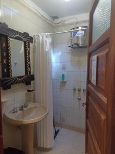 a bathroom with a sink and a shower at Uziel in Humahuaca