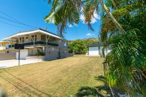 a house with a large yard in front of it at One Bedroom Apartment, Private pool, huge yard in Anasco