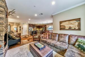 a living room with a brown leather couch at Tahoe Woods 502 at Stateline Lake Heavenly Village in South Lake Tahoe