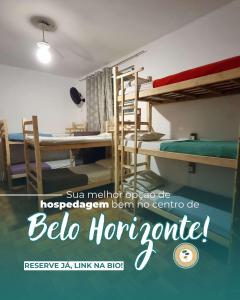 Ένα ή περισσότερα κρεβάτια σε δωμάτιο στο Savassi Hostel