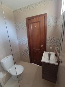 a bathroom with a toilet and a sink at Studio in Calypso,Calahonda 200 metres from the beach in Sitio de Calahonda