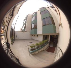 an image of a building with a roundorthole at Hotel La Molina in Lima