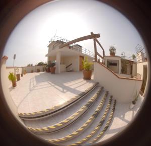 a view from a porthole of a building with stairs at Hotel La Molina in Lima